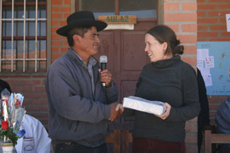 Yamparaez mayor, Anastacio Tango, presenting Latin America Project Coordinator, Megan Sherar, with a small gift at the 1-year anniversary of the library.